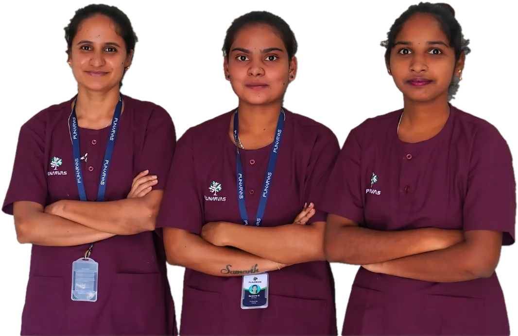 Three Punarvas nurses in purple uniforms